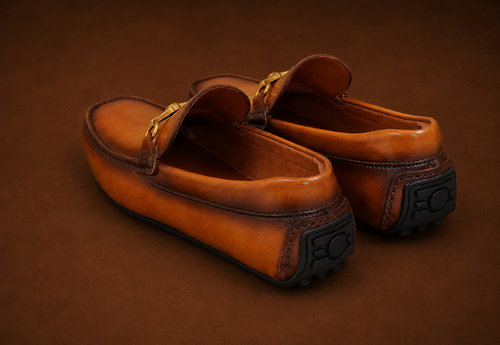 Side and sole view of Hinojosa Horsebit Golf Loafer